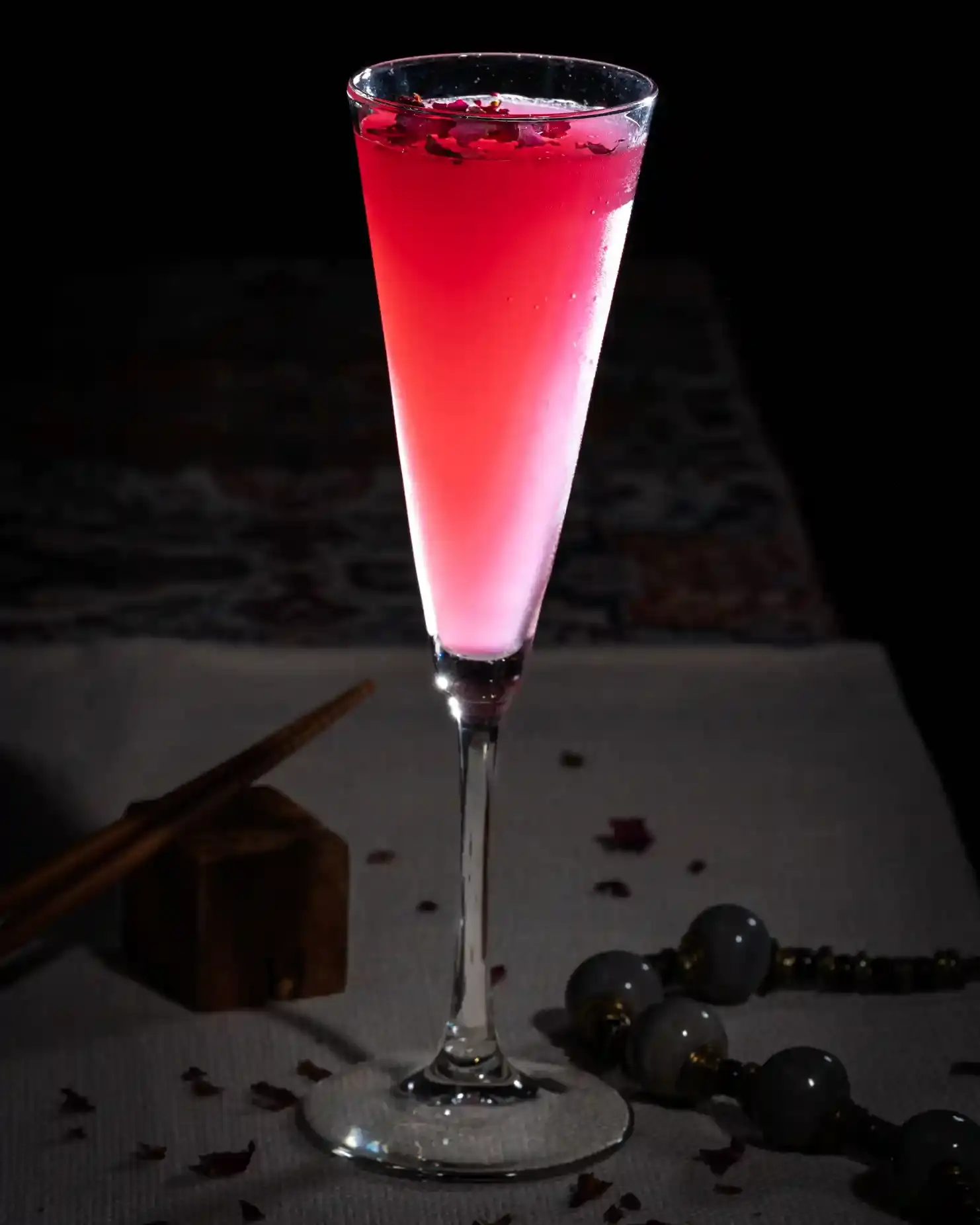 A picture of a Tipsy Tiger signature cocktail, the Indigo Rose